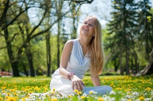 Woman sitting in flowers